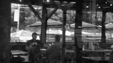 Josh and Tommy framed through a window